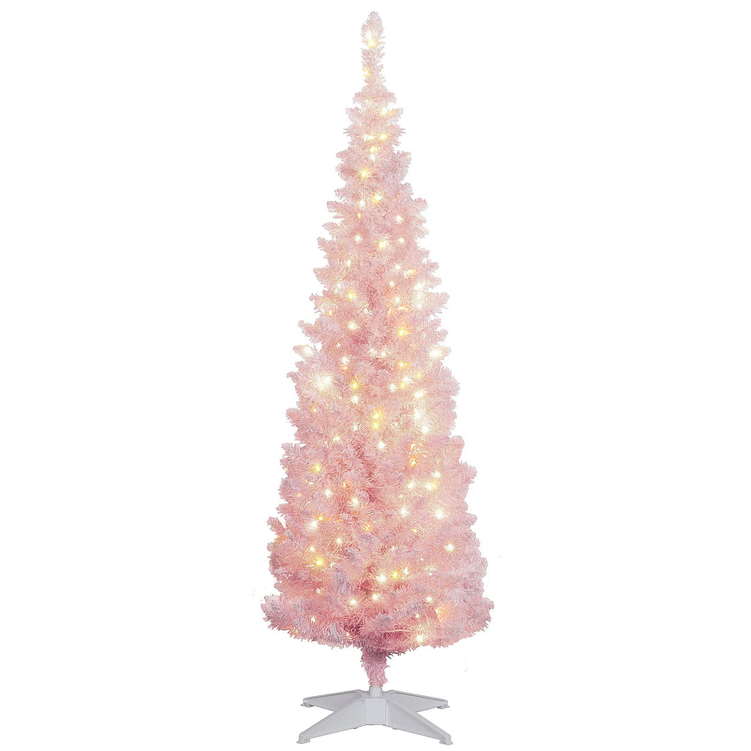 Lite rosa juletre med kunstsnø og lys