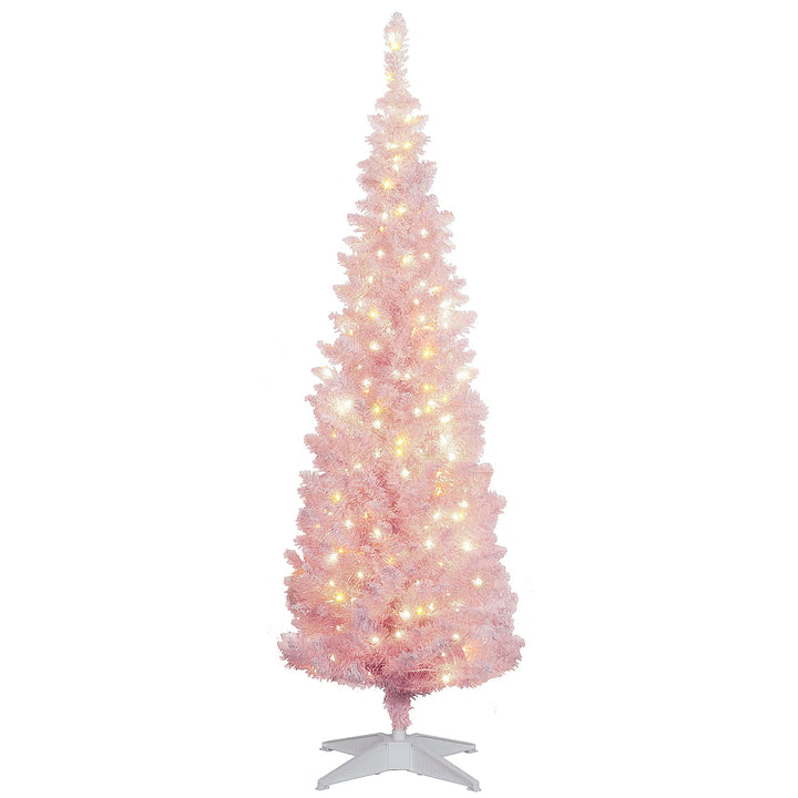 Lite rosa juletre med kunstsnø og lys