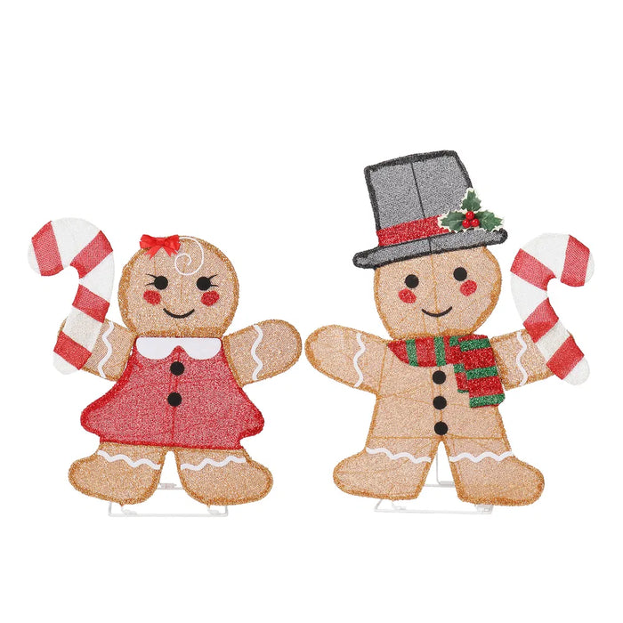 Varmegleden To lysende pepperkakefigurer med polkagris