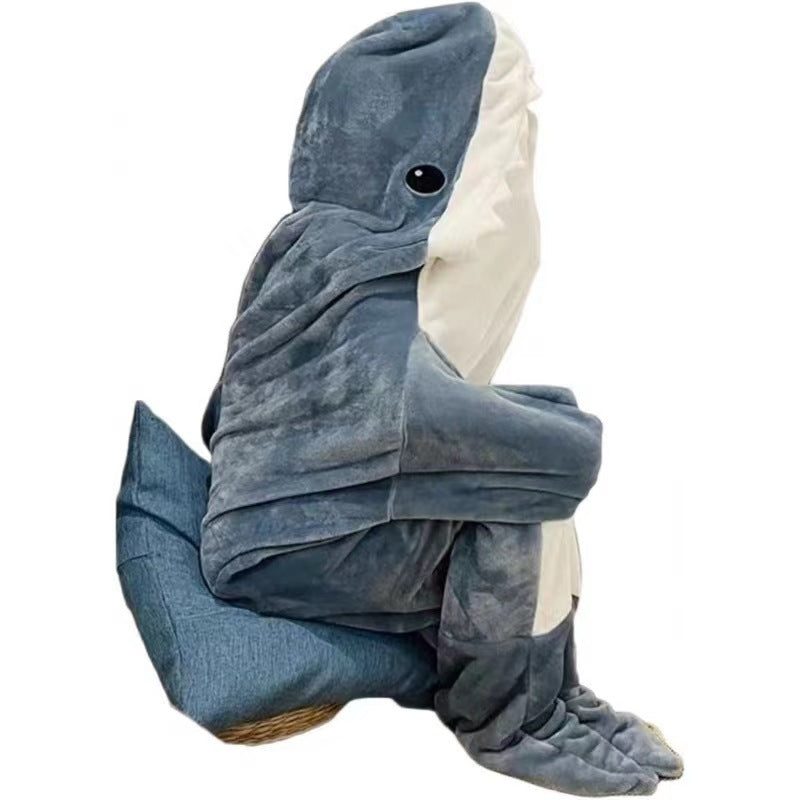 Person i grått haiteppe med hette